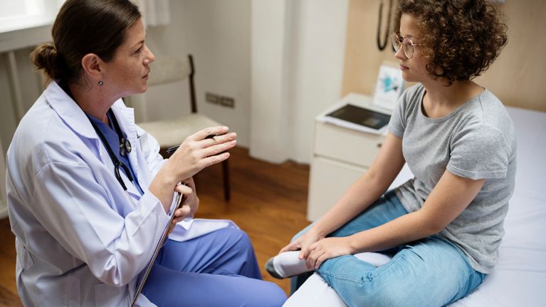 doctor discussing with female patient