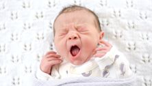 Why is my noisy newborn grunting, snoring and whistling in their sleep?
