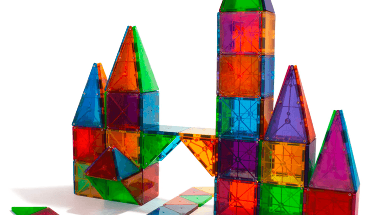 magna-tiles tower built on a white background
